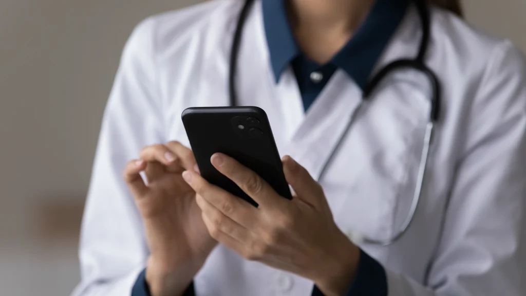 nimbus employee scheduling mobile app - doctor on phone