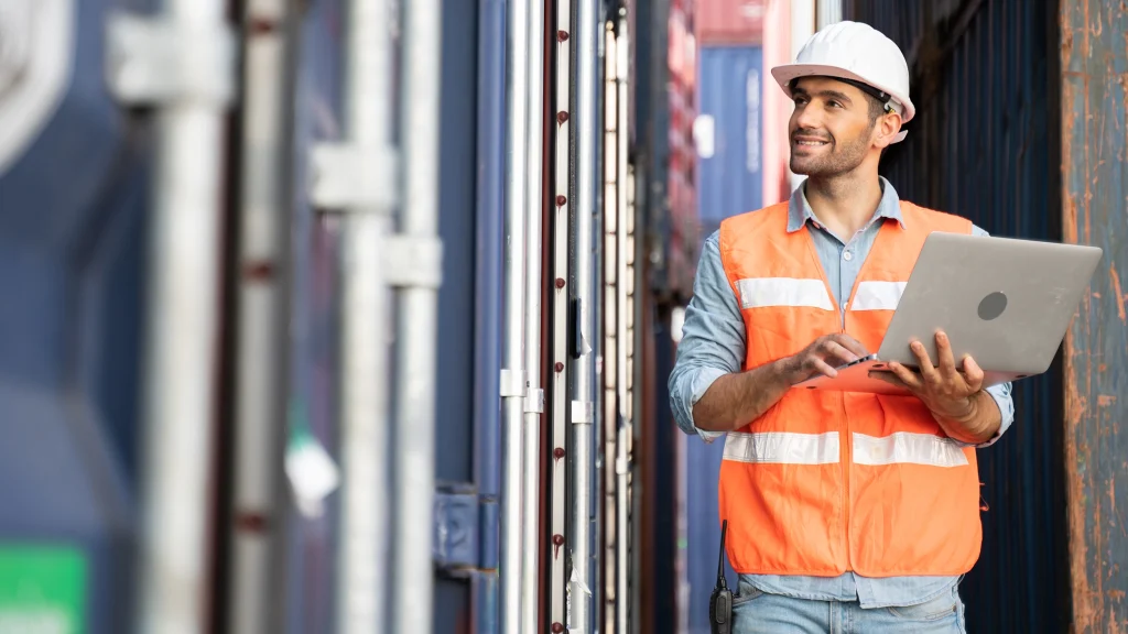 nimbus time management software for time tracking and attendance - man working at ports using mobile device